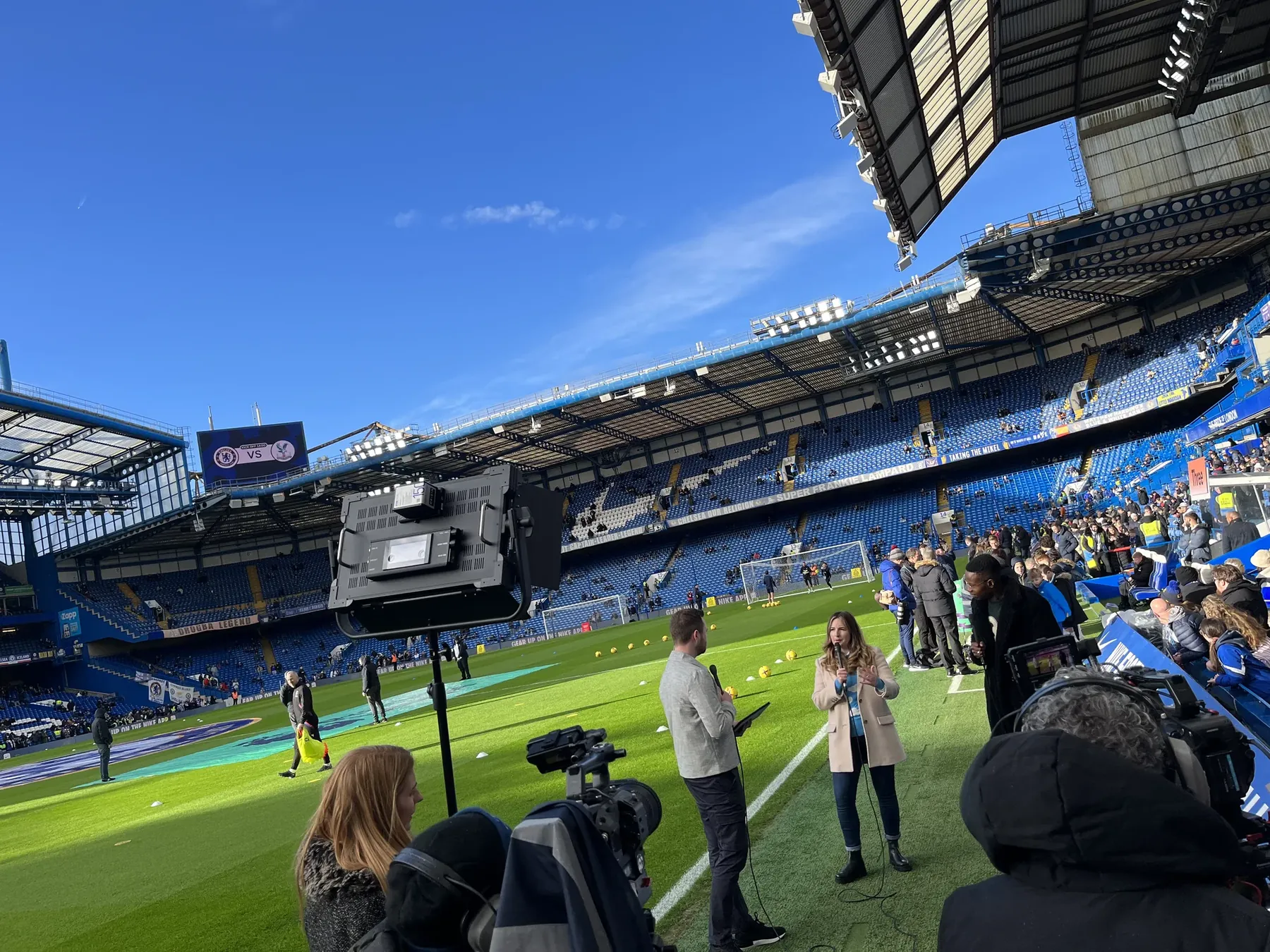 A pitchside broadcast interview being filmed at Stamford Bridge