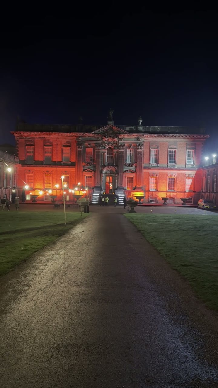 A completed outdoor lighting installation operating at a Halloween event
