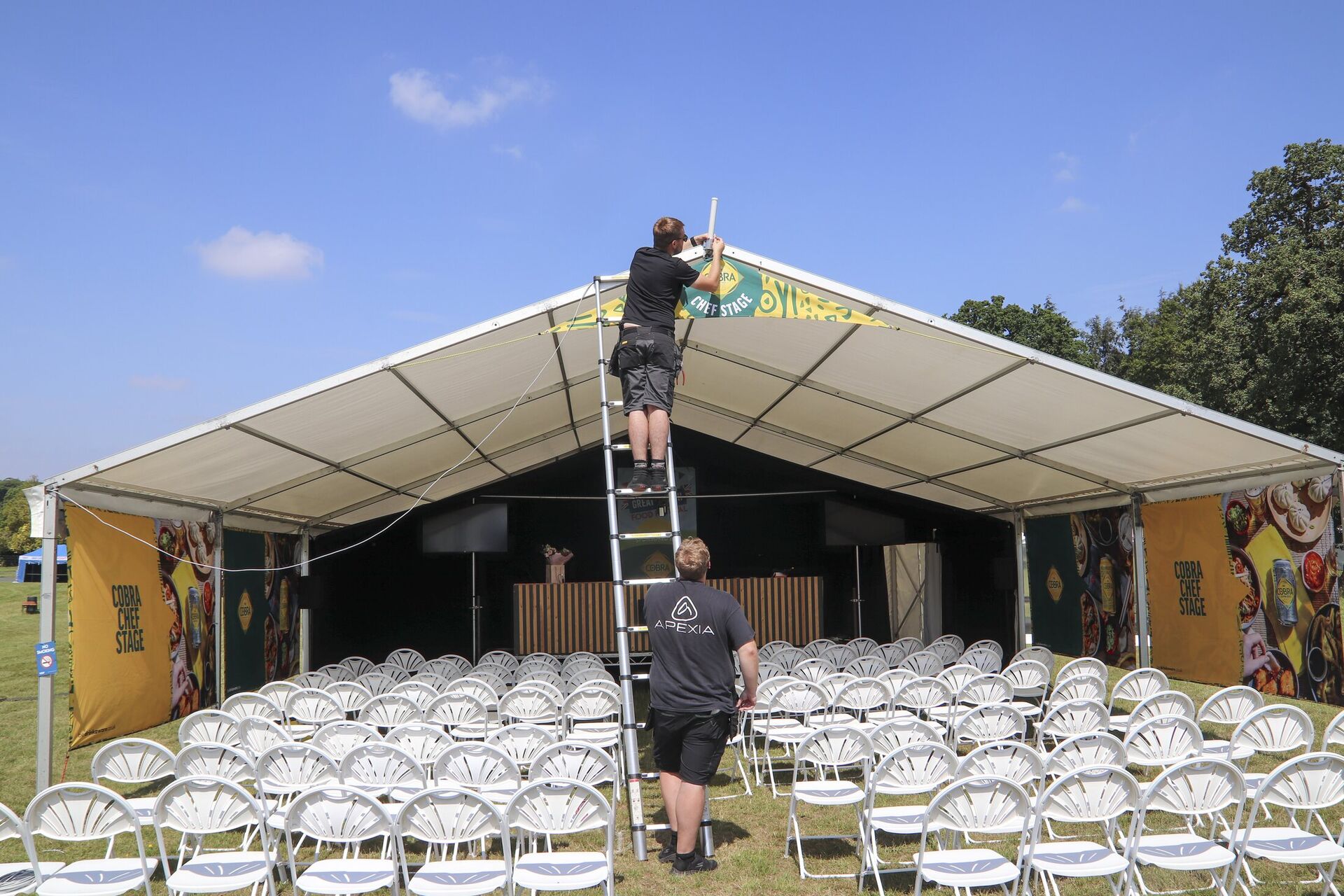 Apexia technicians installing event technology on site