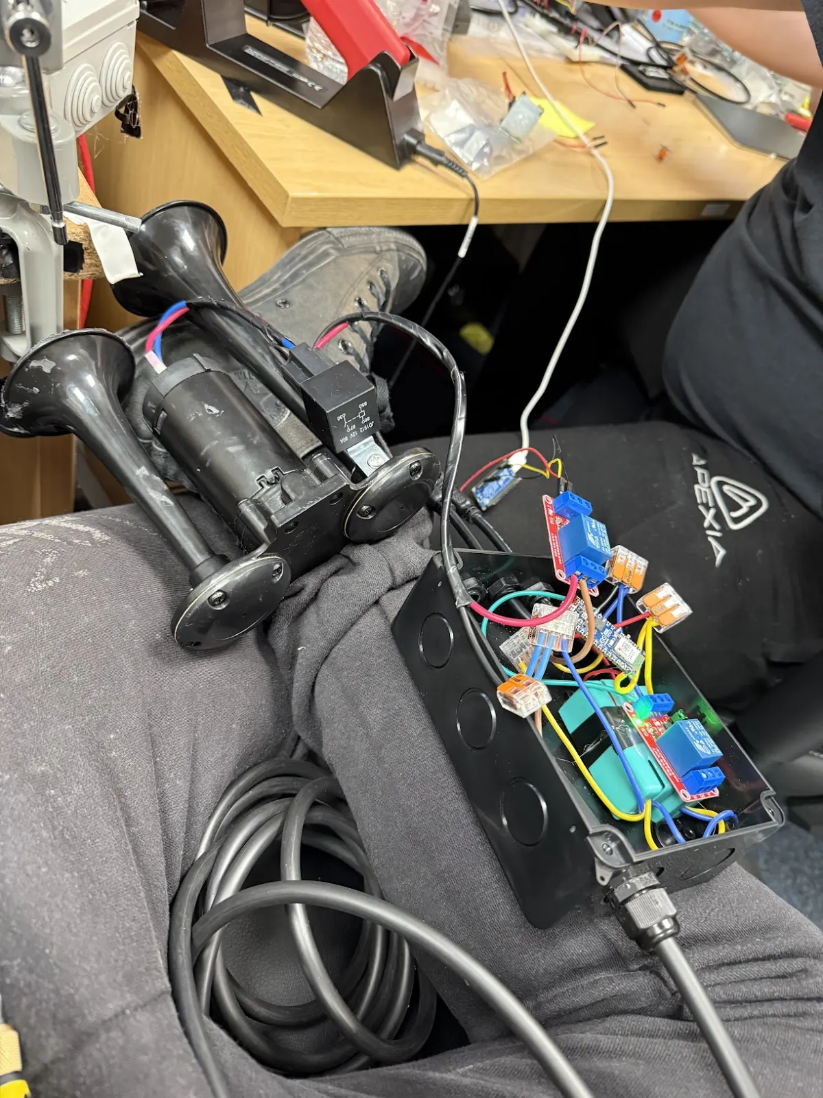 A relay-switched air horn controller wired into a weatherproof enclosure on the workbench